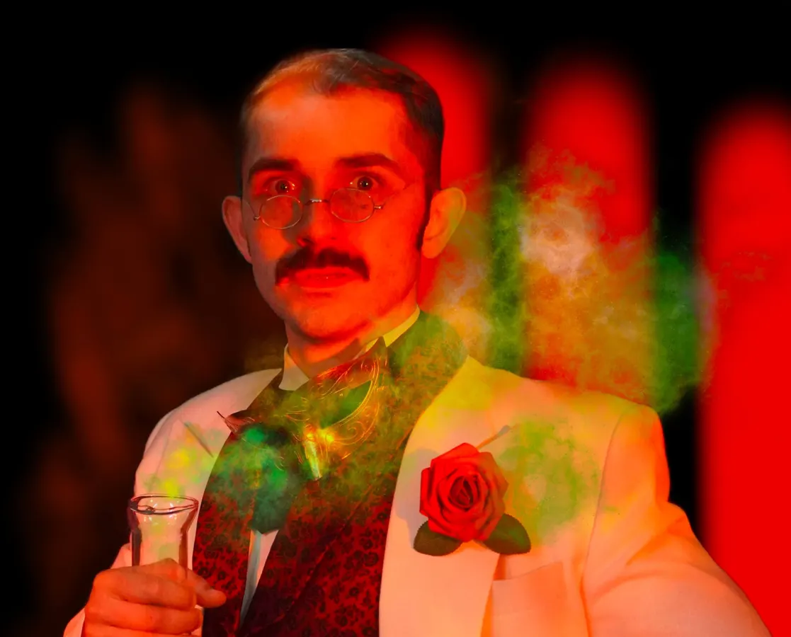 Illuminated by an eerie red glow, Dr. Jekyll holds a beaker brimming with green liquid as noxious gas fills the space.