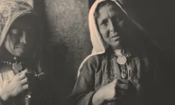 Archival photo of Palestinian women in their traditional attire.